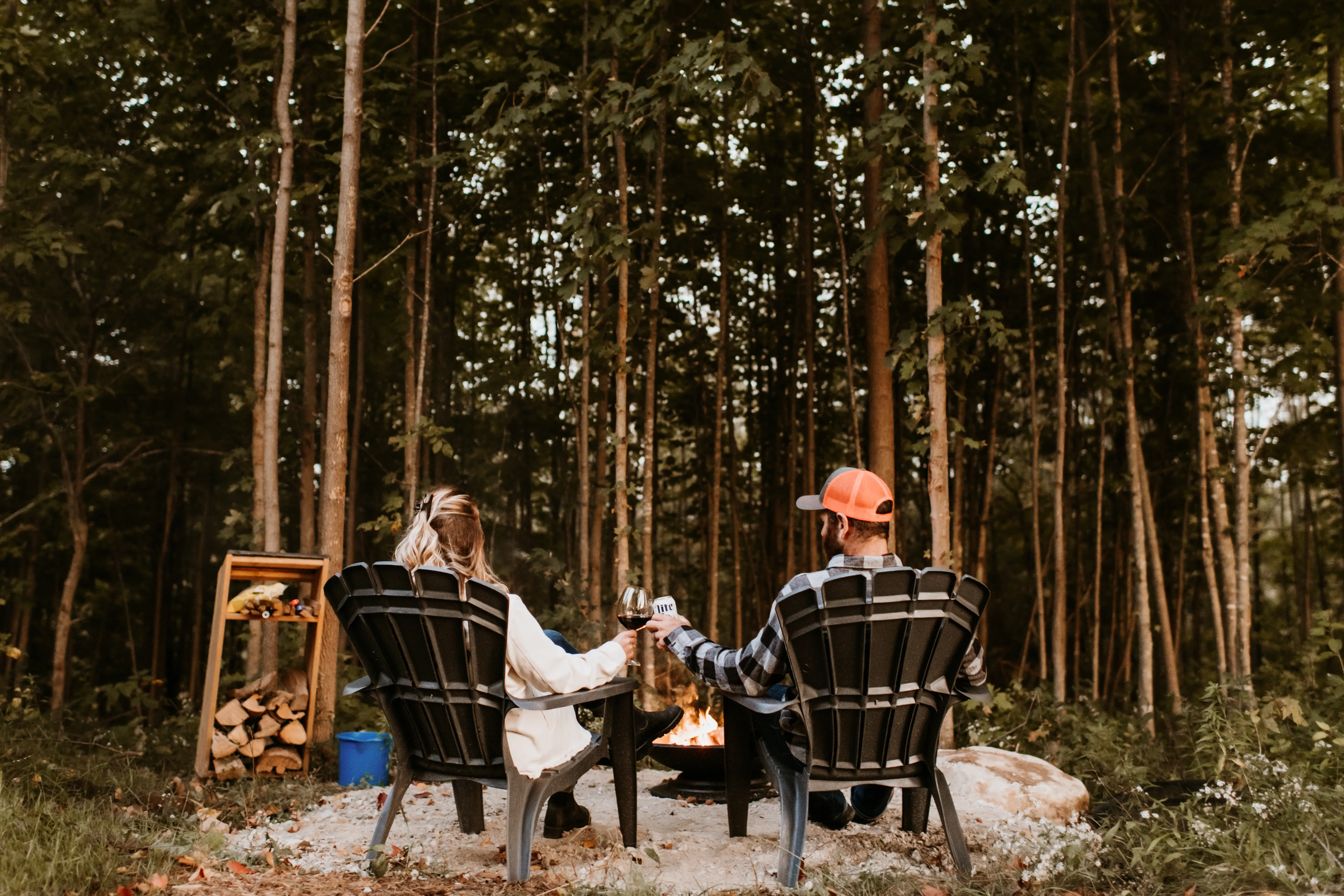 Couple Enjoying Drinks By The Fire