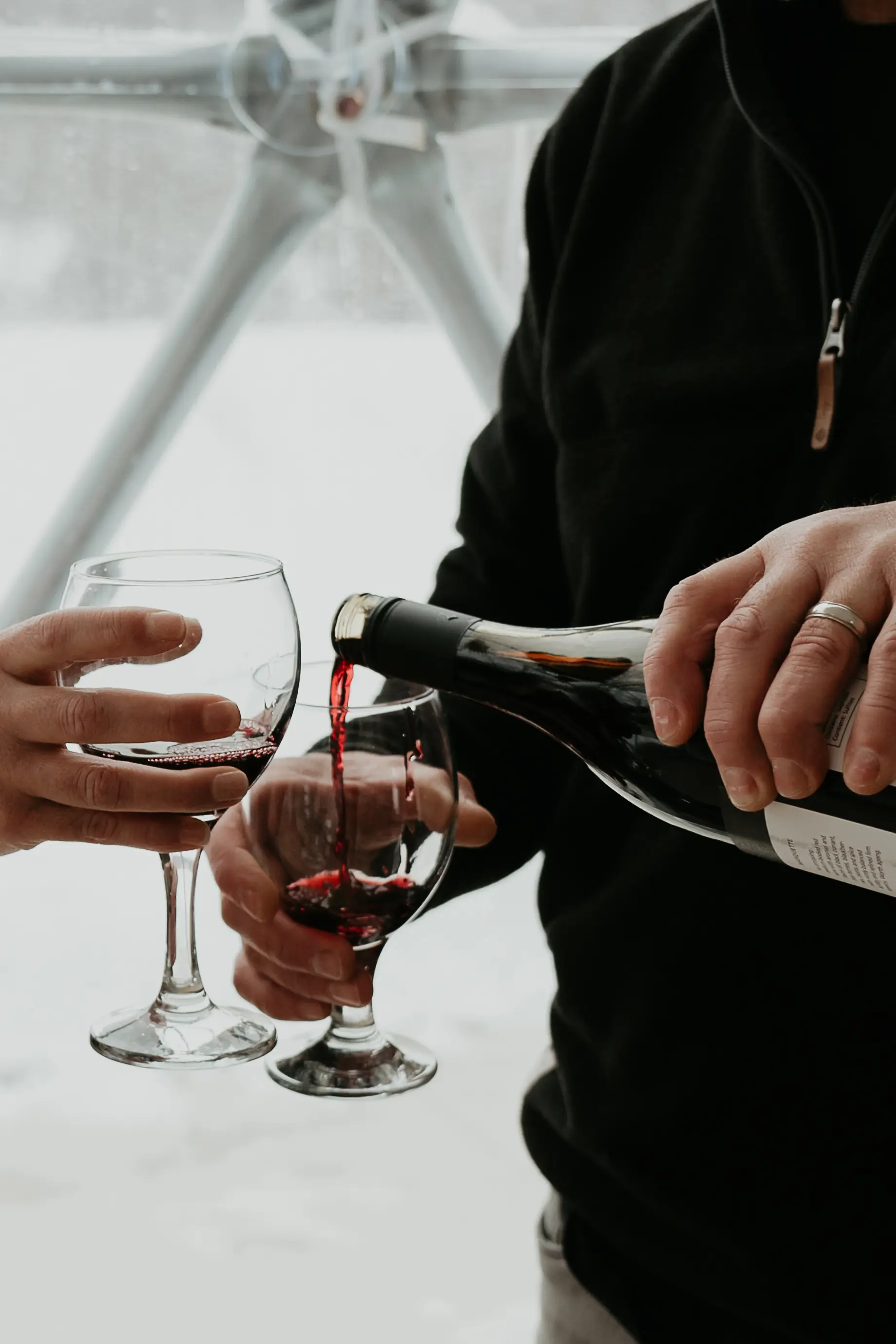 Couple Enjoying Wine On A Winter Escape