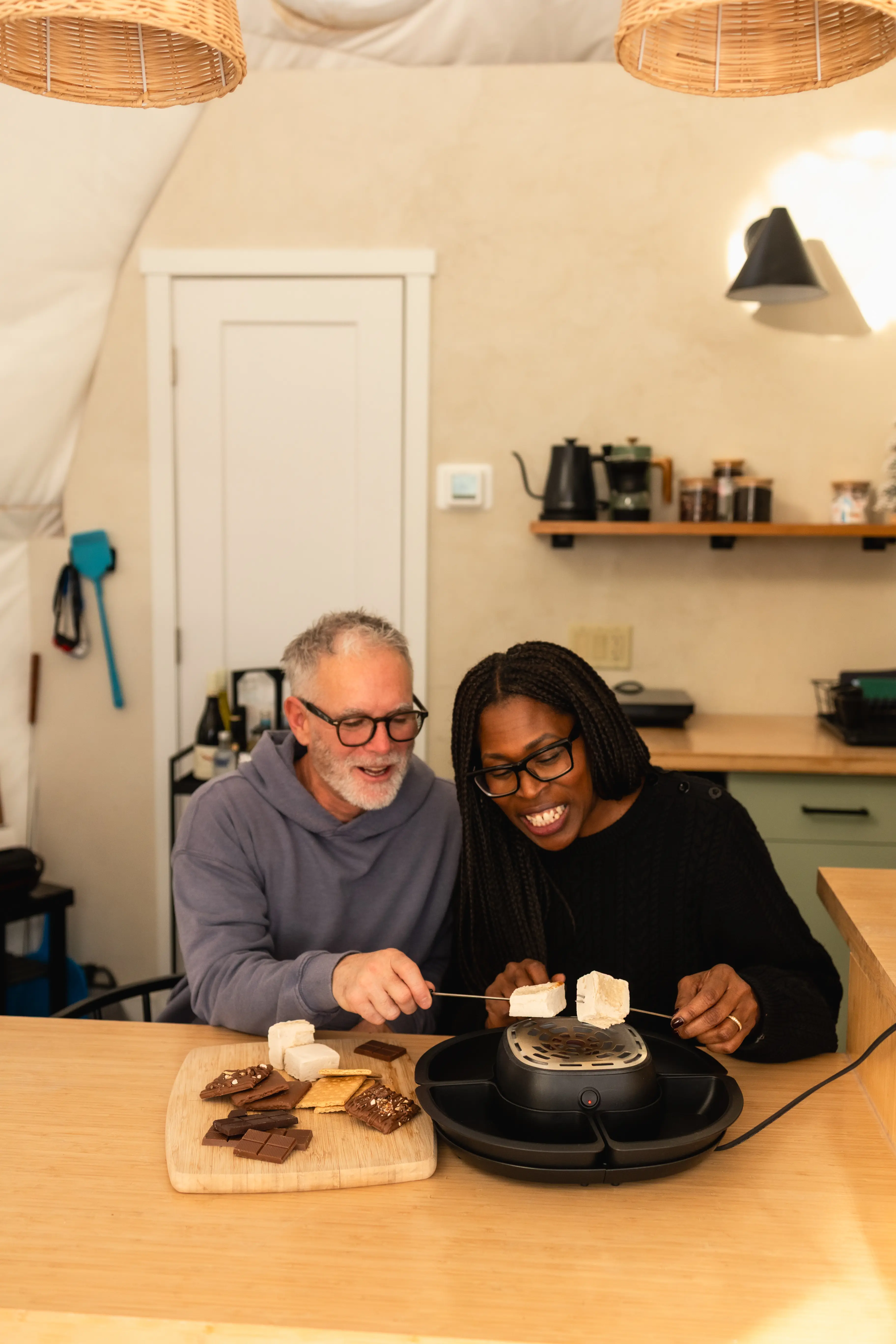 Couple Making Smores In The Dome