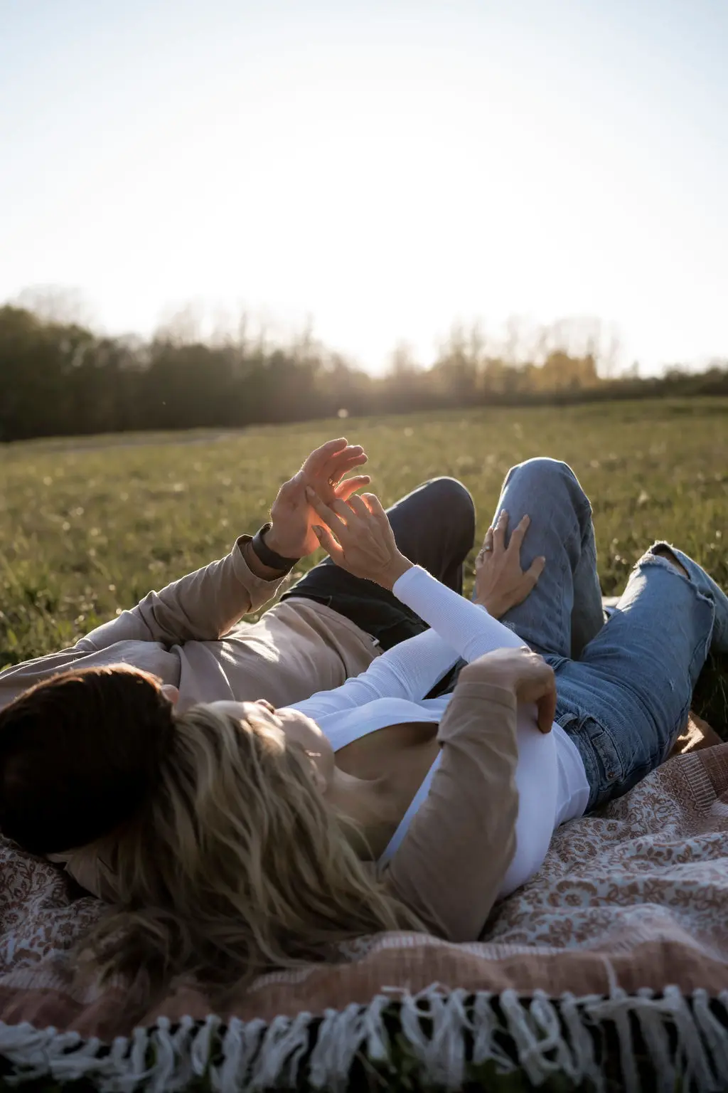 Couple Relaxing In The Meadow