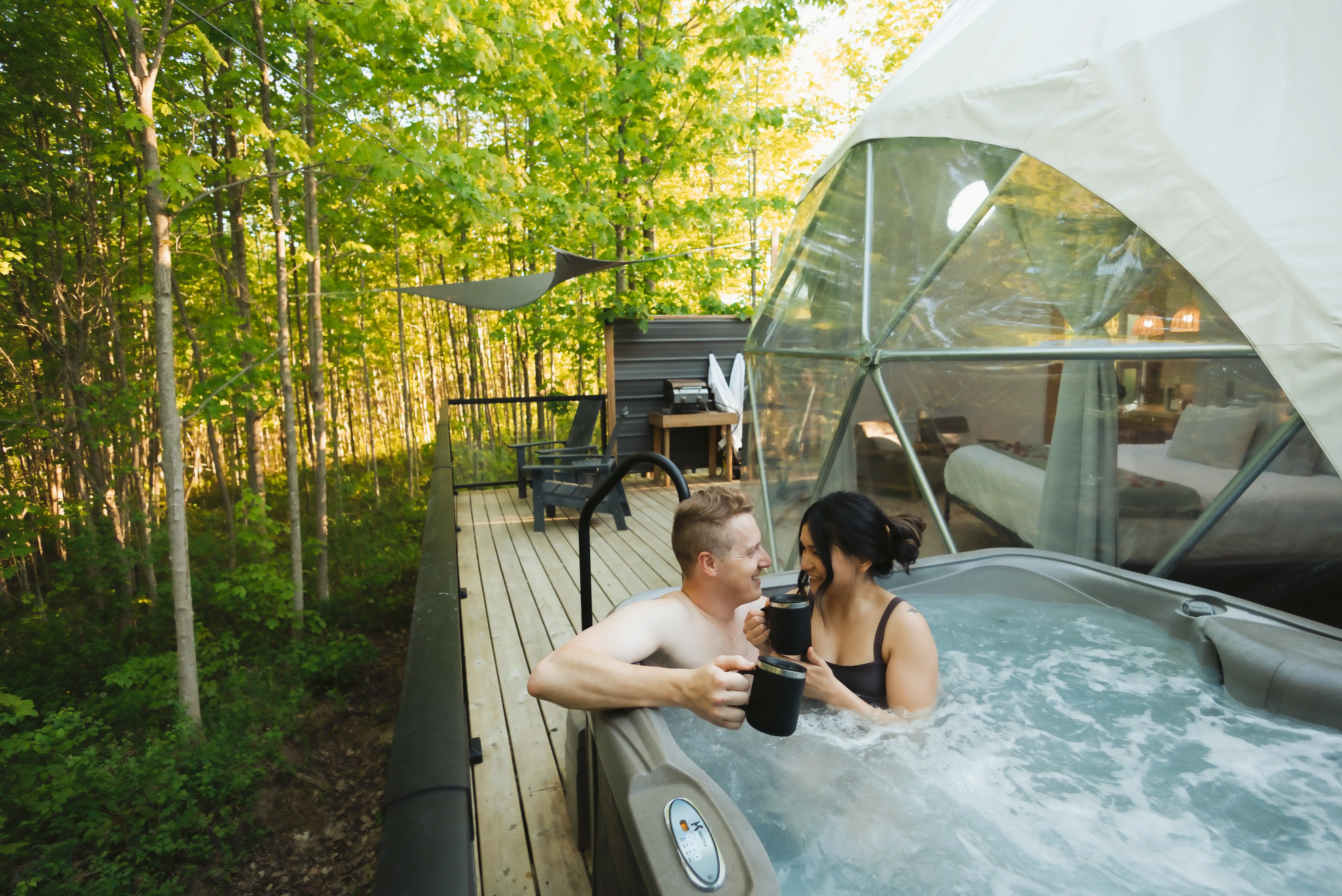 Couple Relaxing In The Private Hot Tub