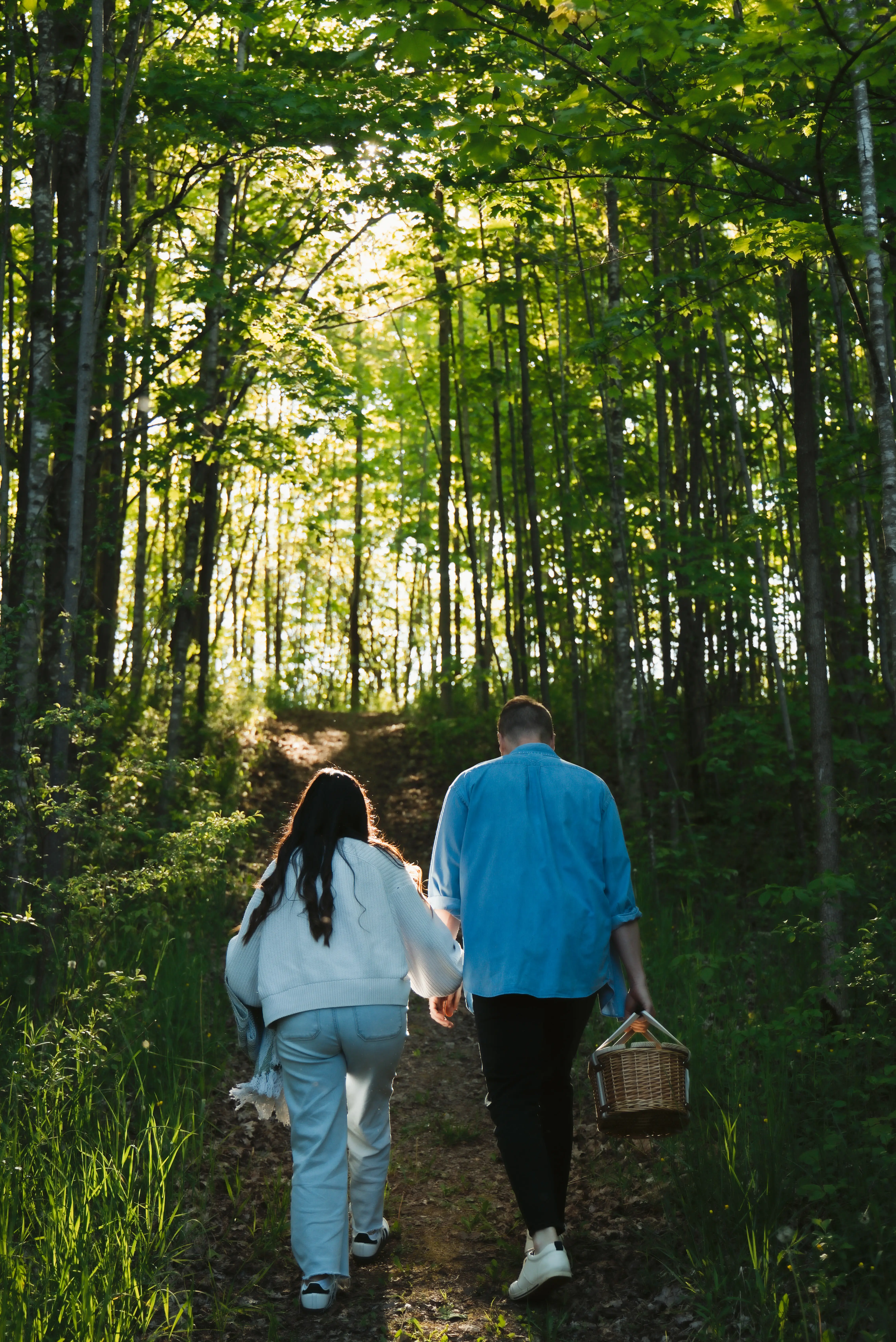 Couple Walking Through The Forest